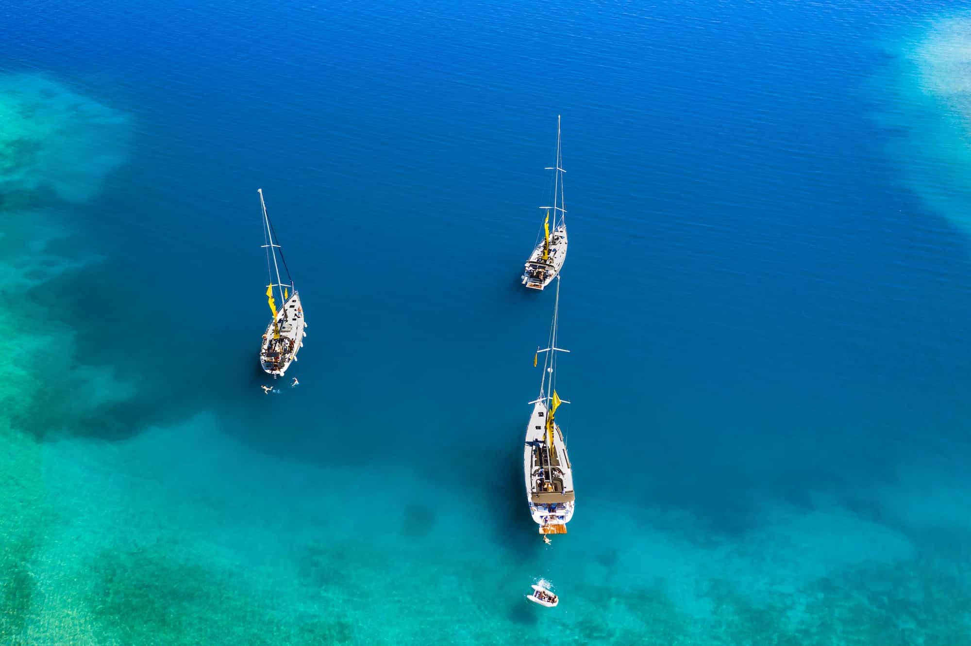 Yachts in the bay near the green island. Summer vacation, Greece, Kefalonia