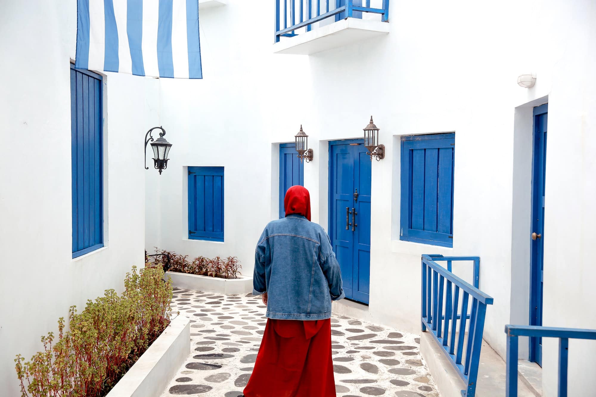 Girl walking forward at Santorini