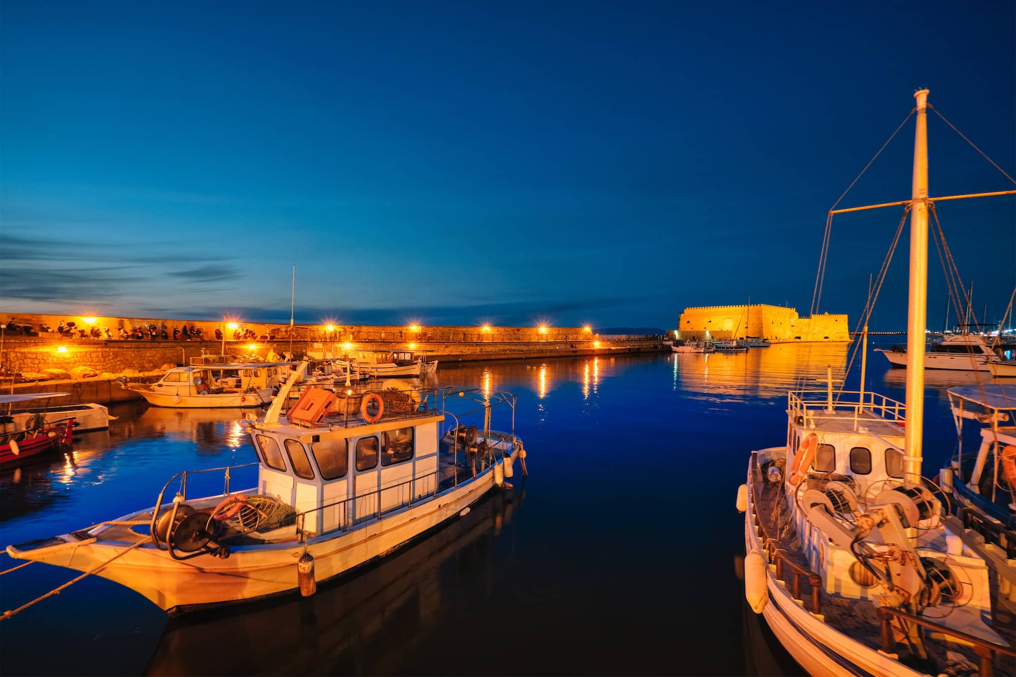 Venetian Fort in Heraklion and moored fishing boats, Crete Island, Greece