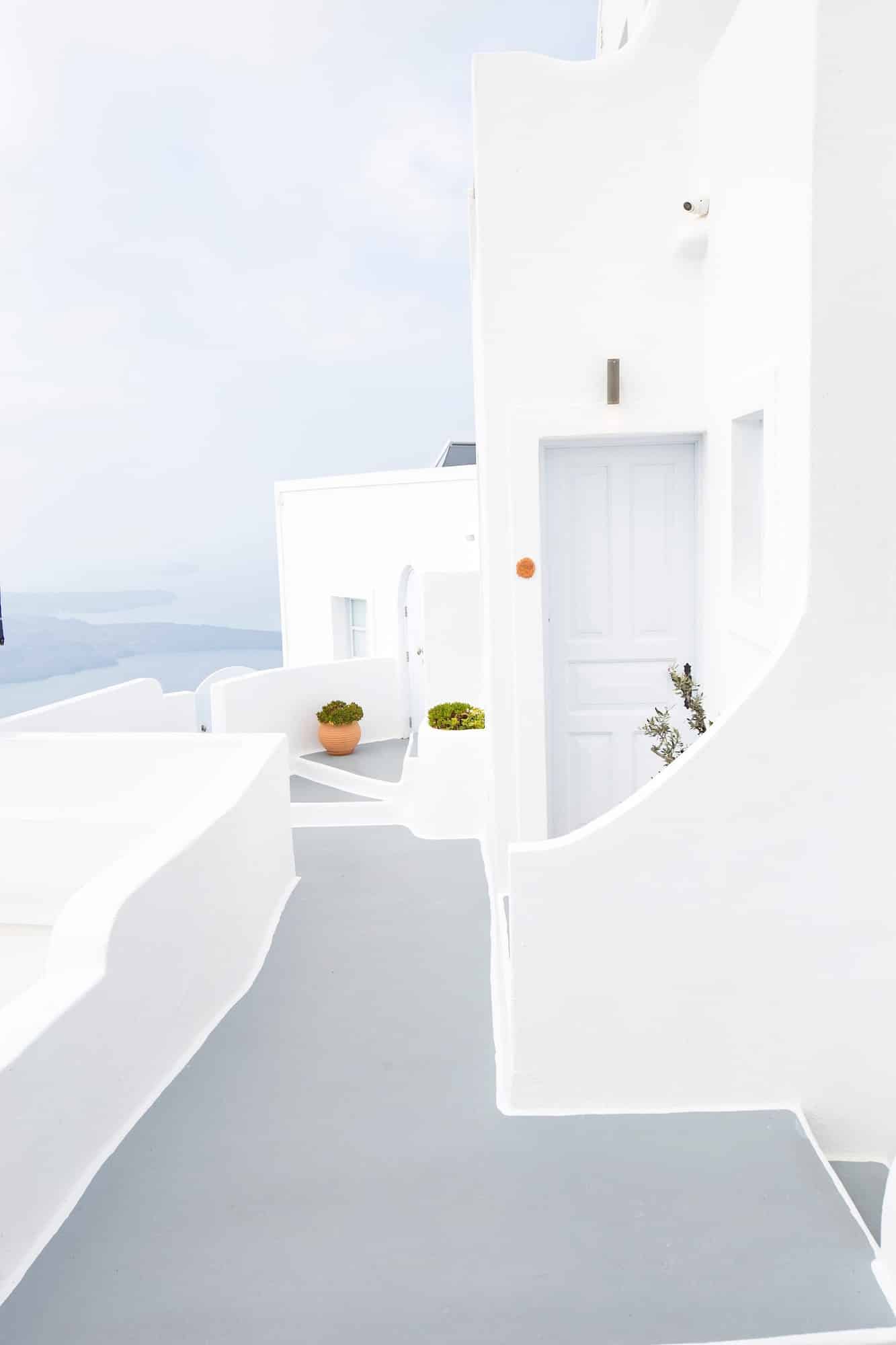 White exterior home in santorini with Aegean Sea view