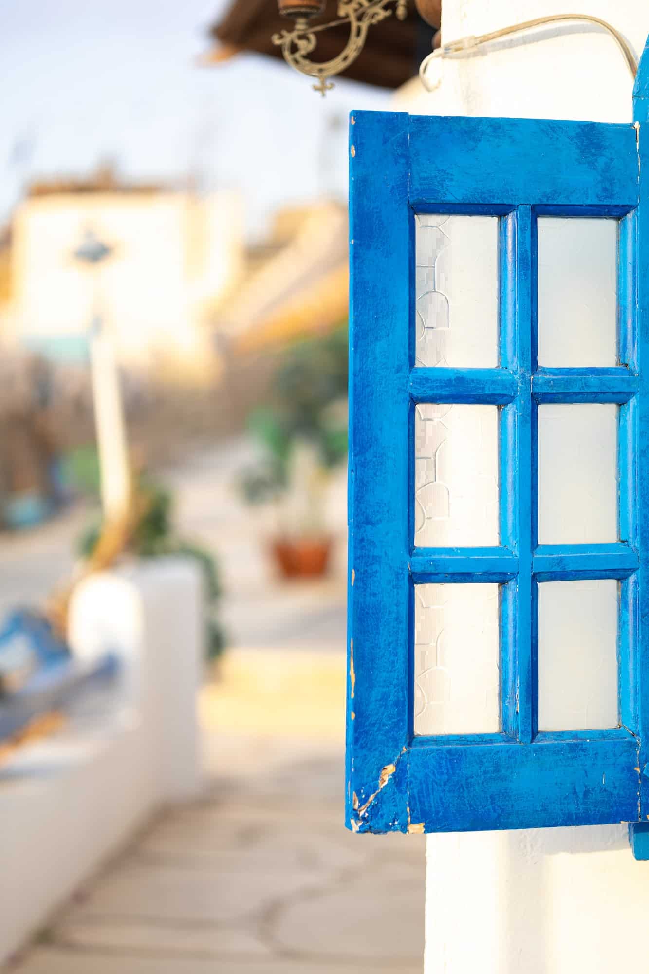 White and blue architecture on Santorini island on blurred background Traditional greek house and ch