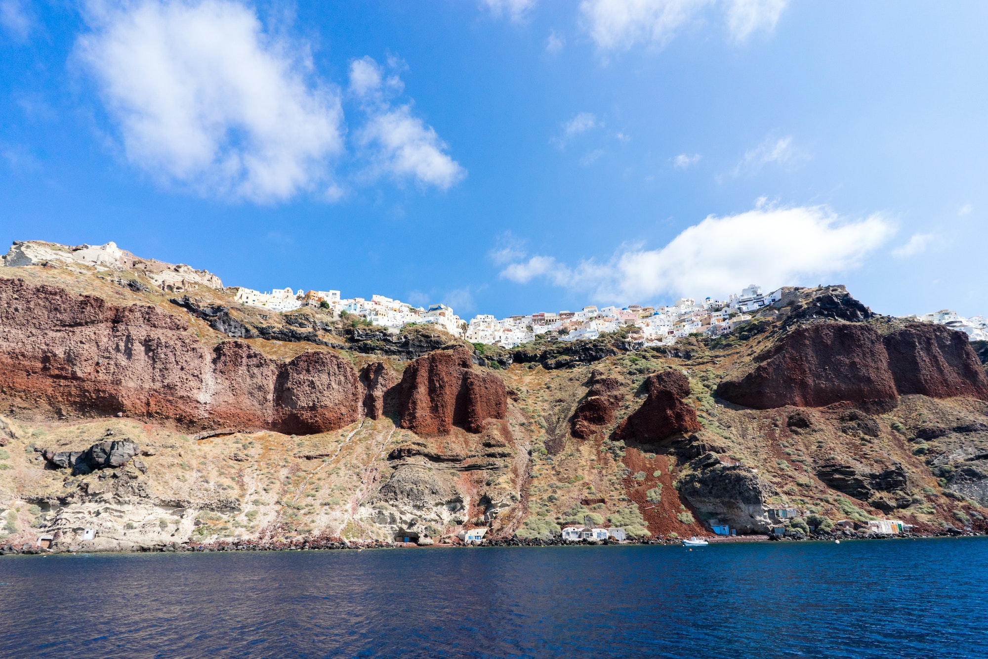 Sailing the Aegean Sea in Santorini, beautiful view of the town Oia