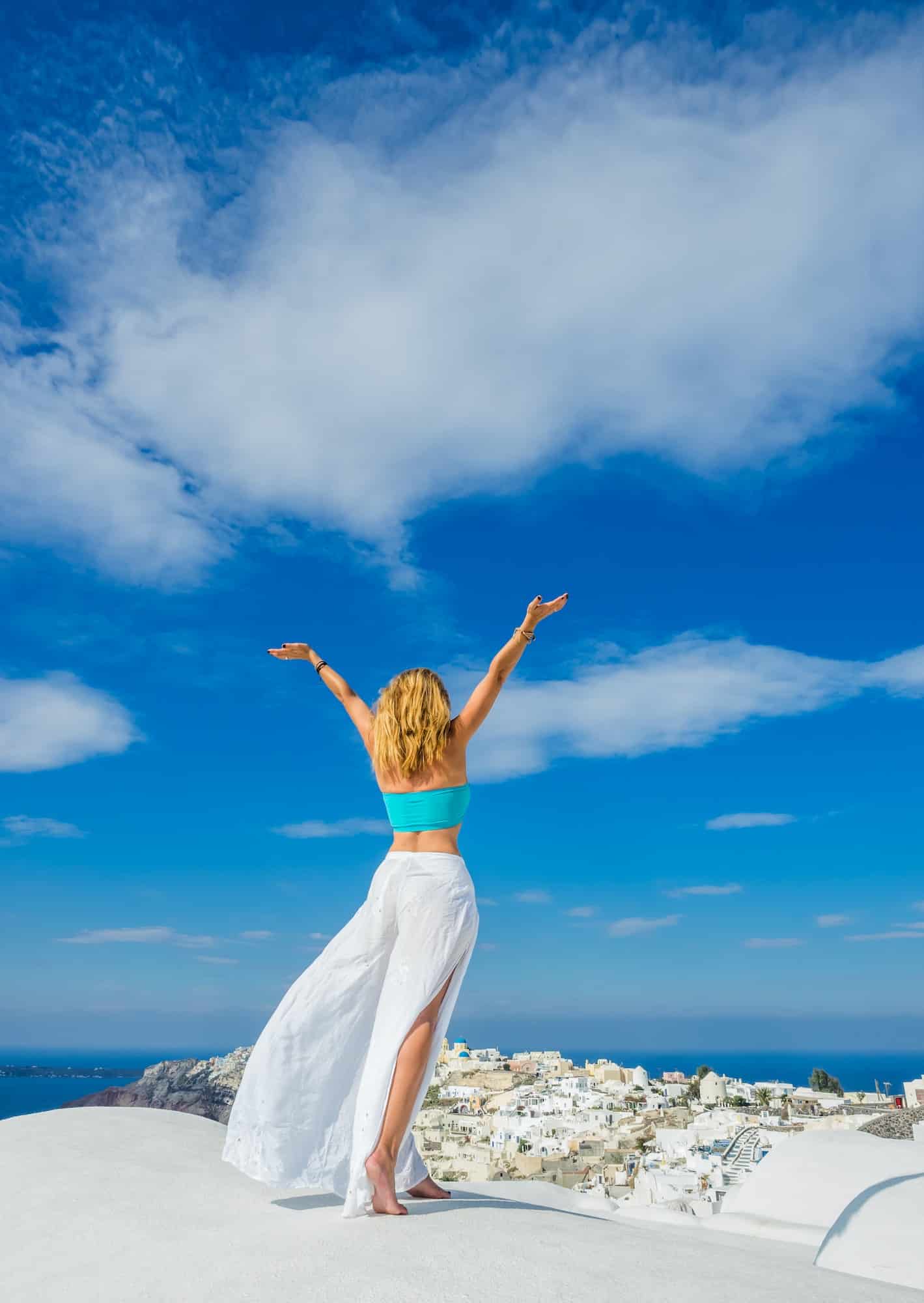 WOman on the rooftop in Santorini Greece
