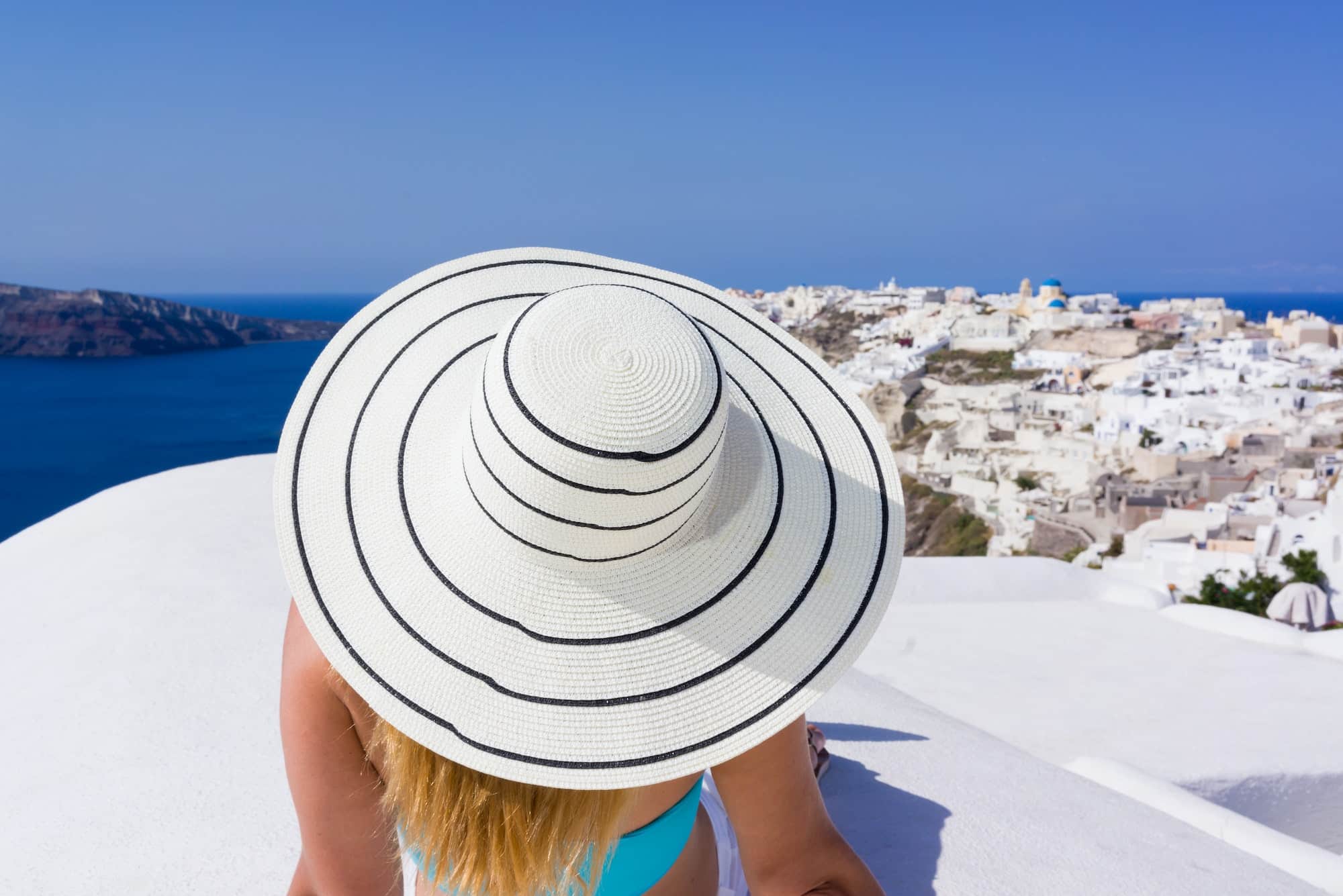 Young woman on holidays, Santorini Oia town