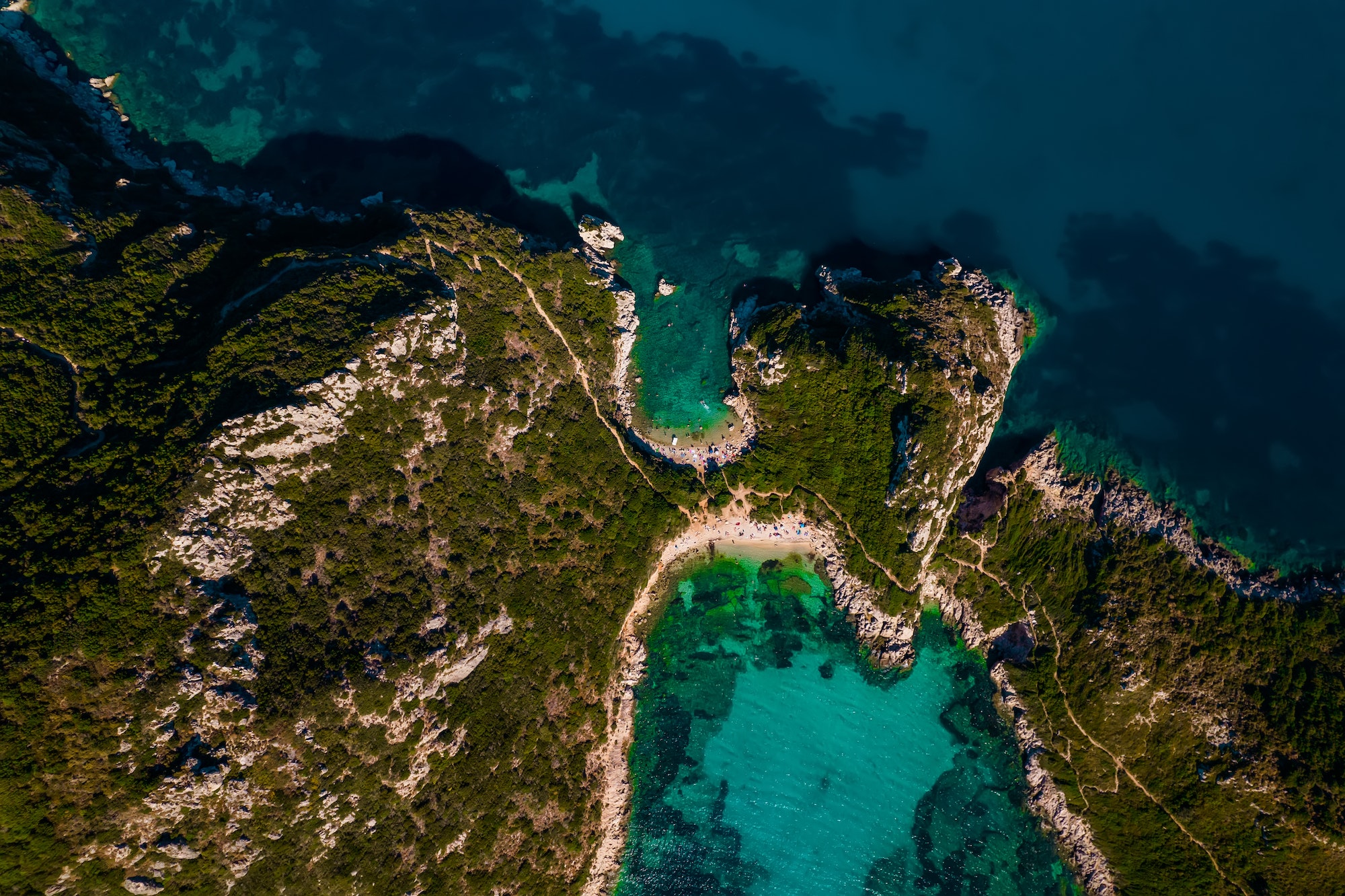 Aerial drone view to Porto Timoni paradise beach with clear teal Ionian sea water. Greece Corfu