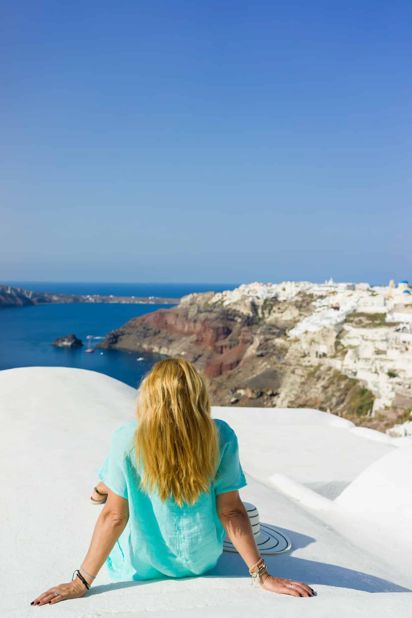 Woman on holidays in Santorini Greece