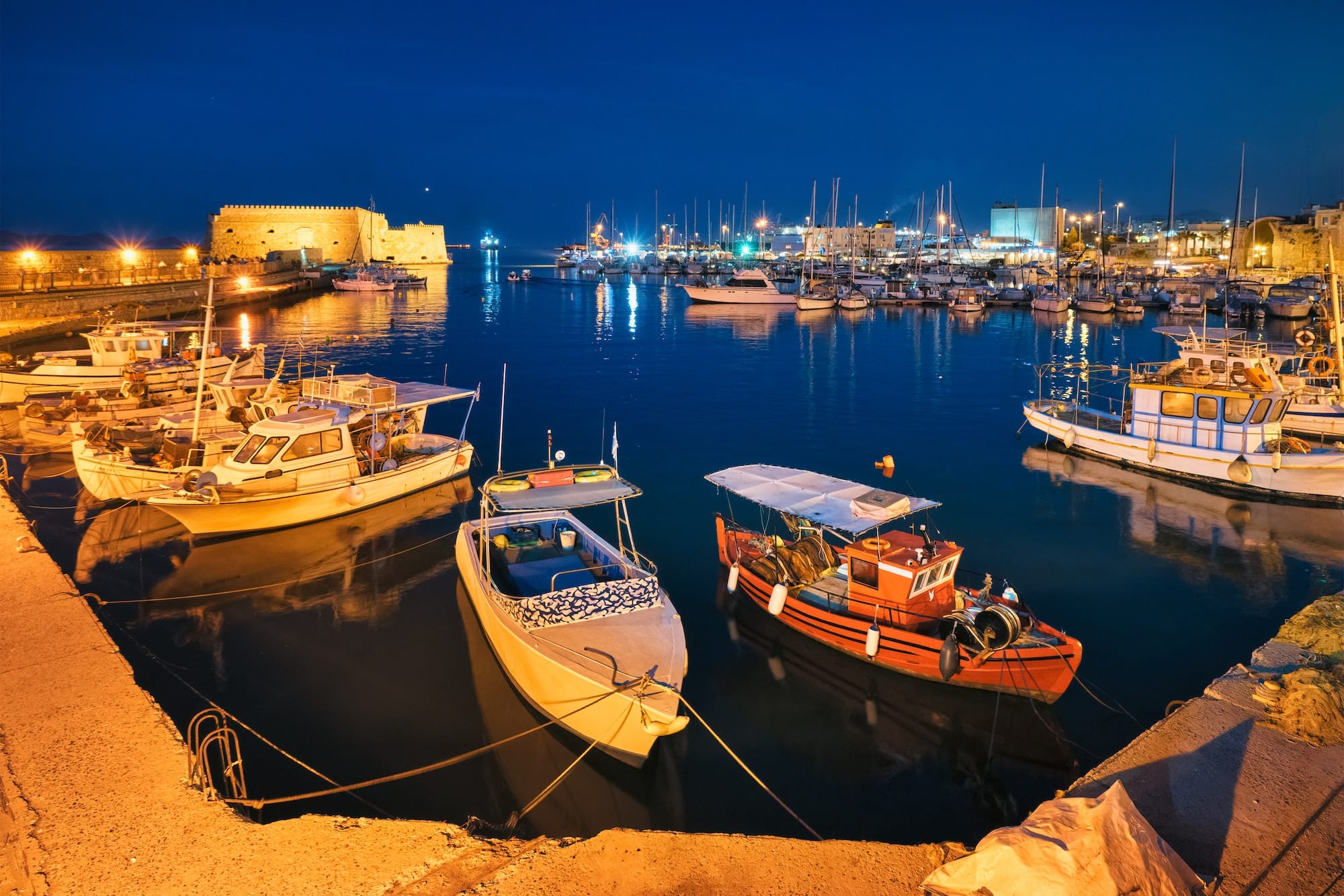 Venetian Fort in Heraklion and moored fishing boats, Crete Island, Greece