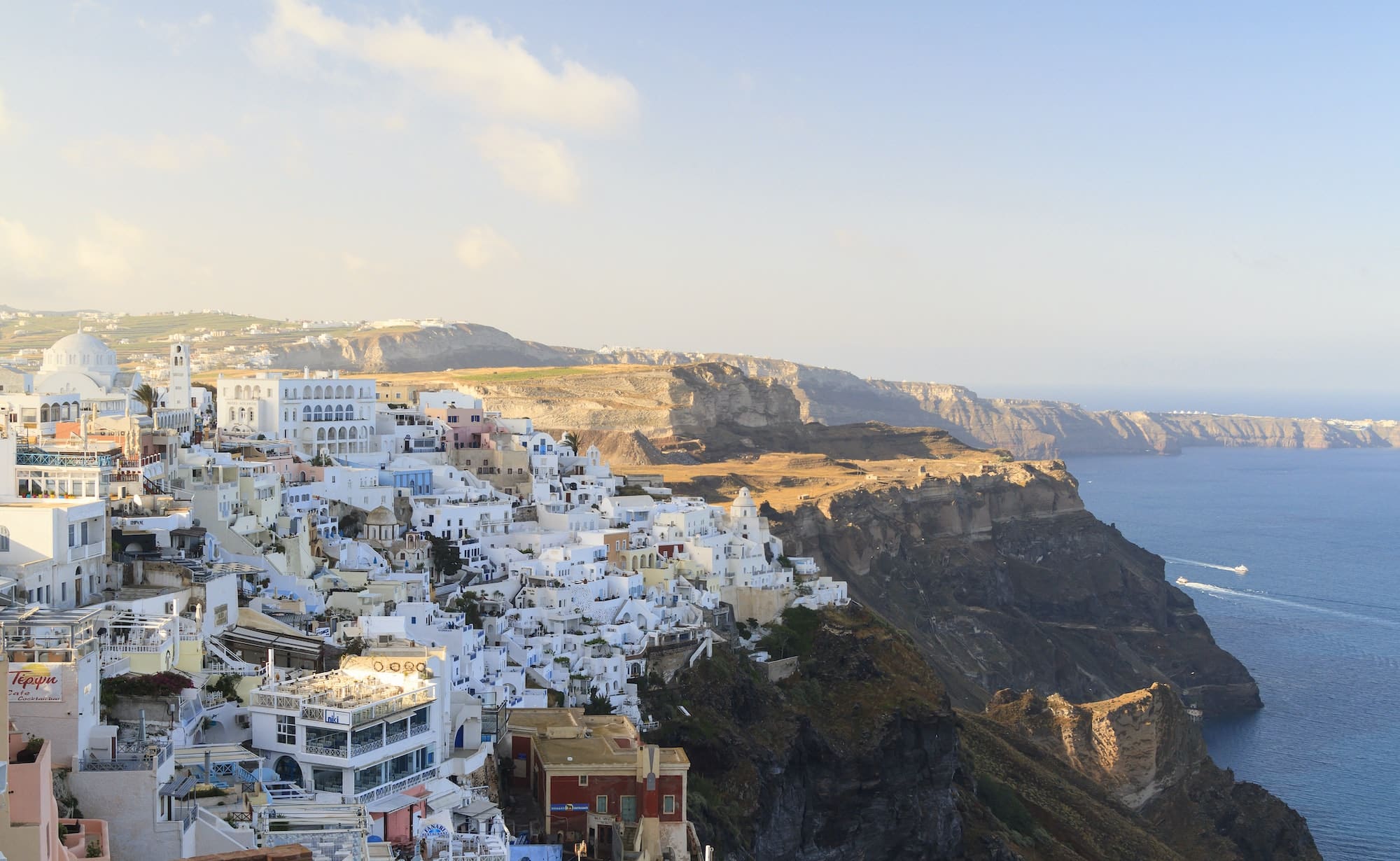 Fira town on Santorini hanging on cliffs edge. Vacation destination on Santorini, Cyclades in Greece