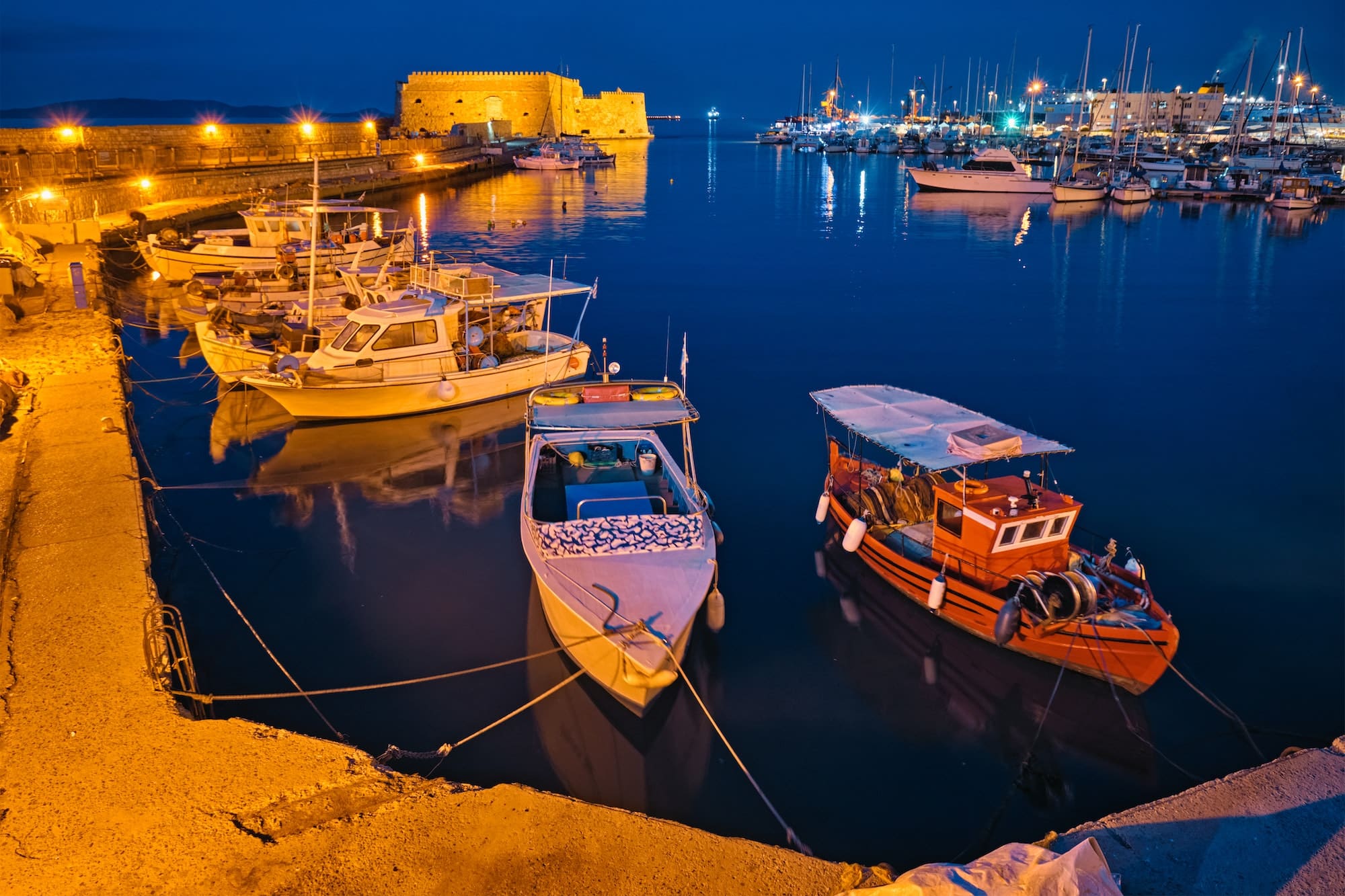 Venetian Fort in Heraklion and moored fishing boats, Crete Island, Greece