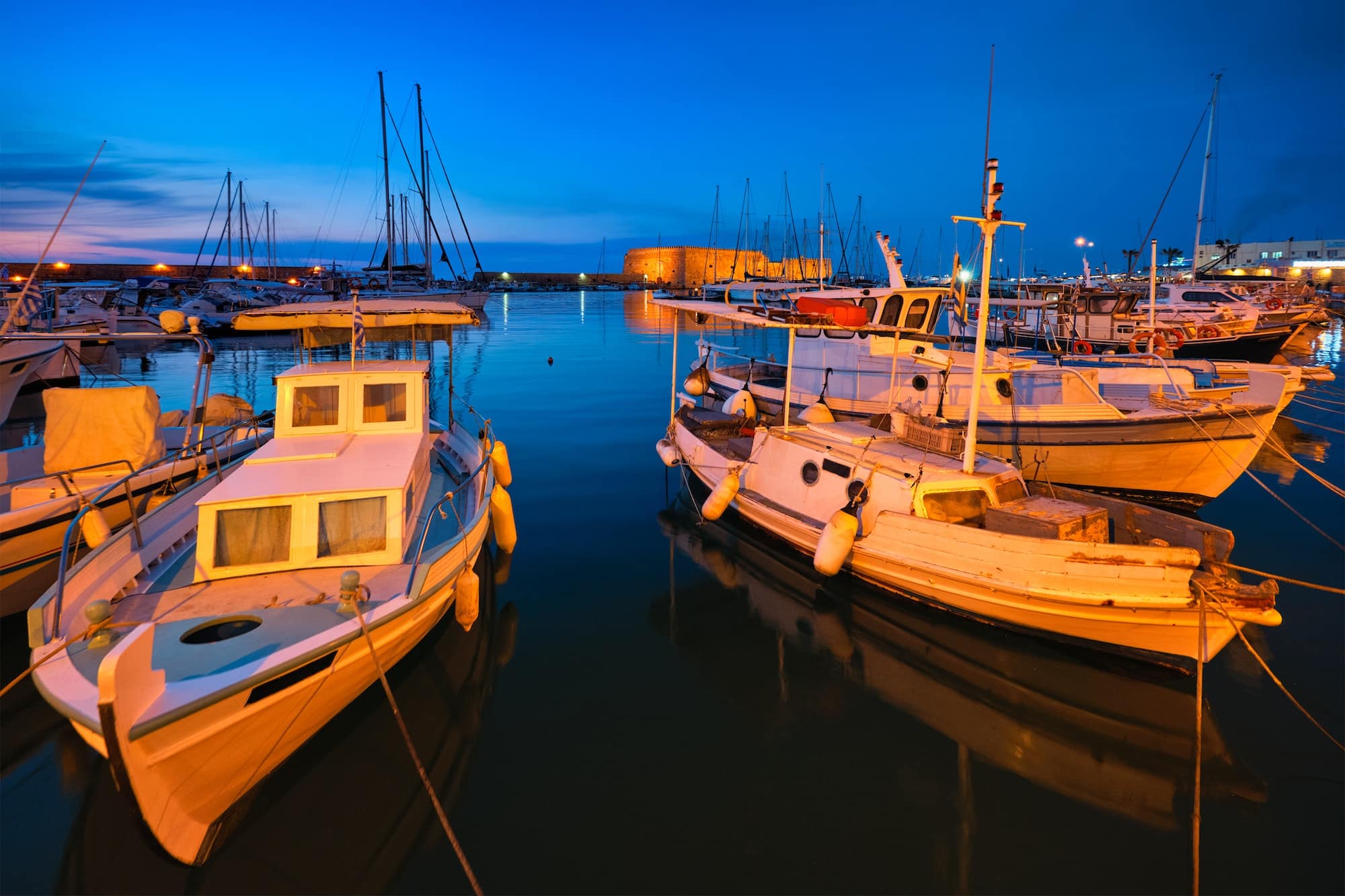 Venetian Fort in Heraklion and moored fishing boats, Crete Island, Greece