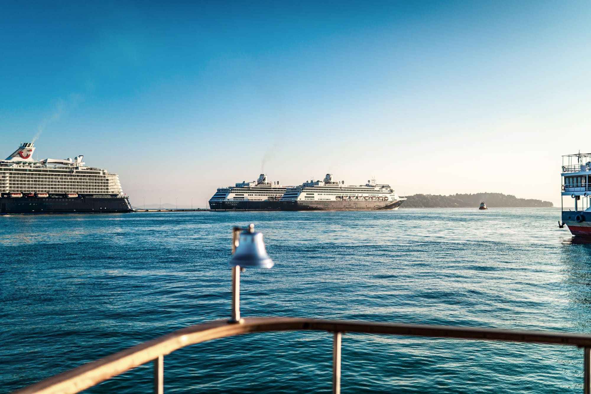 Huge cruise ships sail on sea surface near Corfu island