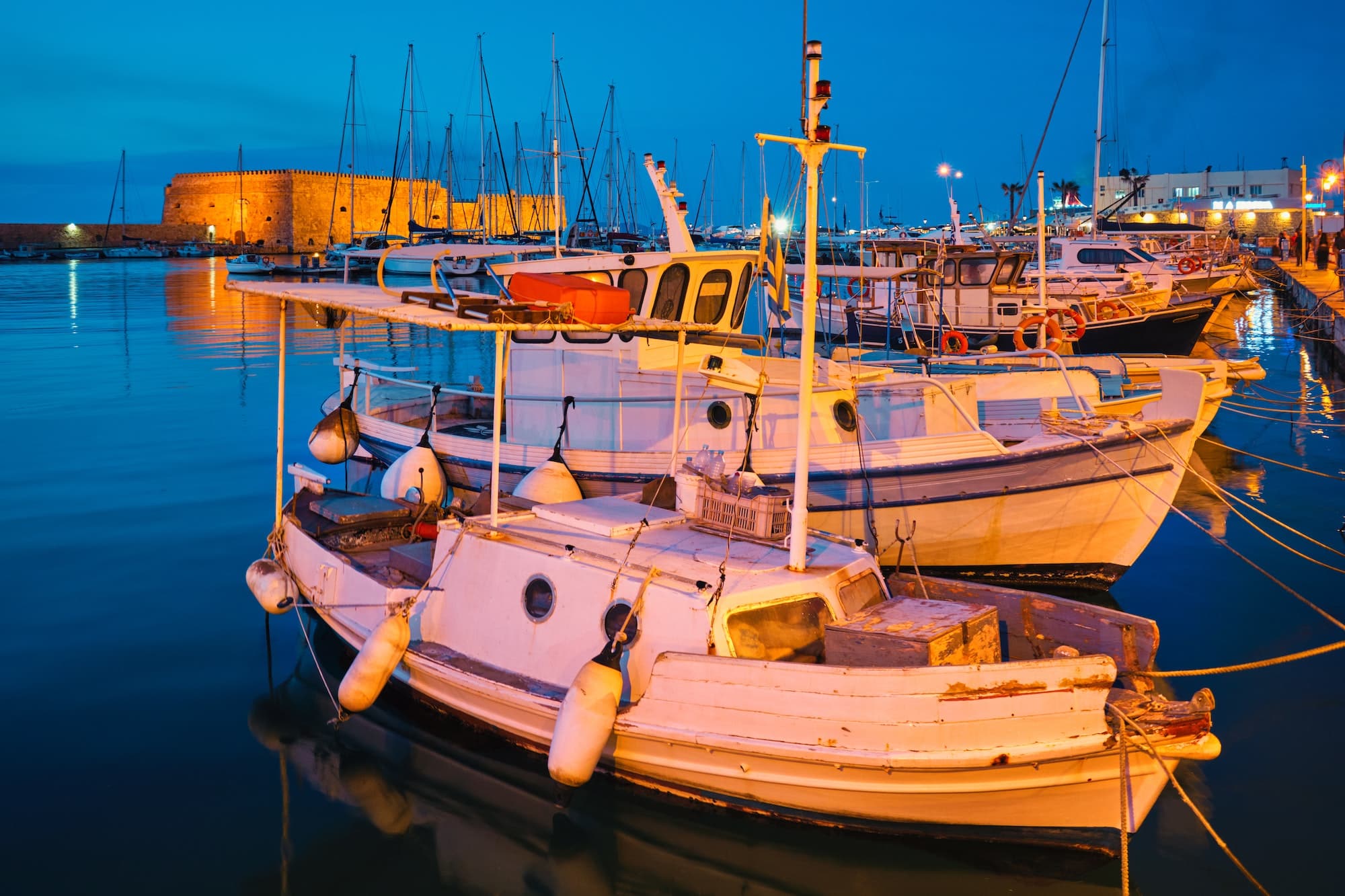 Venetian Fort in Heraklion and moored fishing boats, Crete Island, Greece