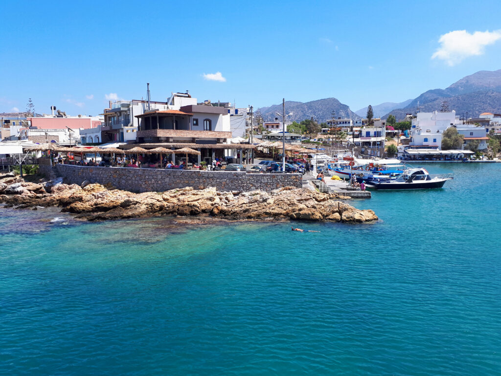 Malia city with restaurants and people