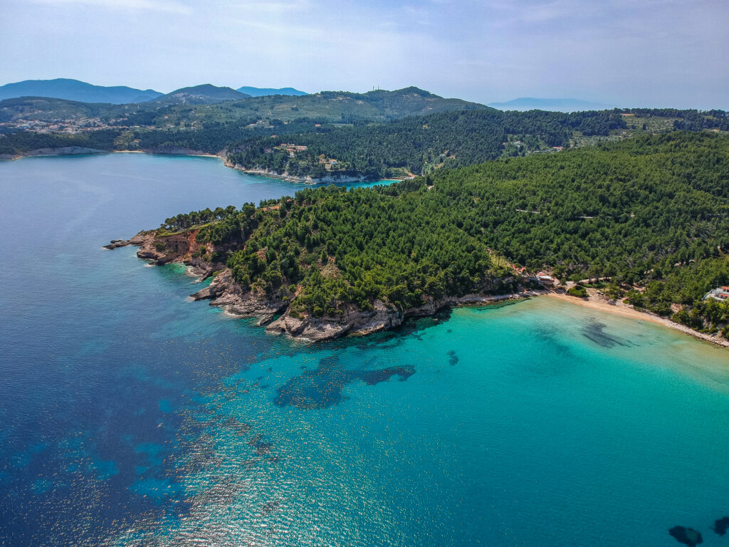 Aerial drone view over Chrisi Milia beach and the rocky surrounded area in Alonnisos island, Sporades, Greece, Europe