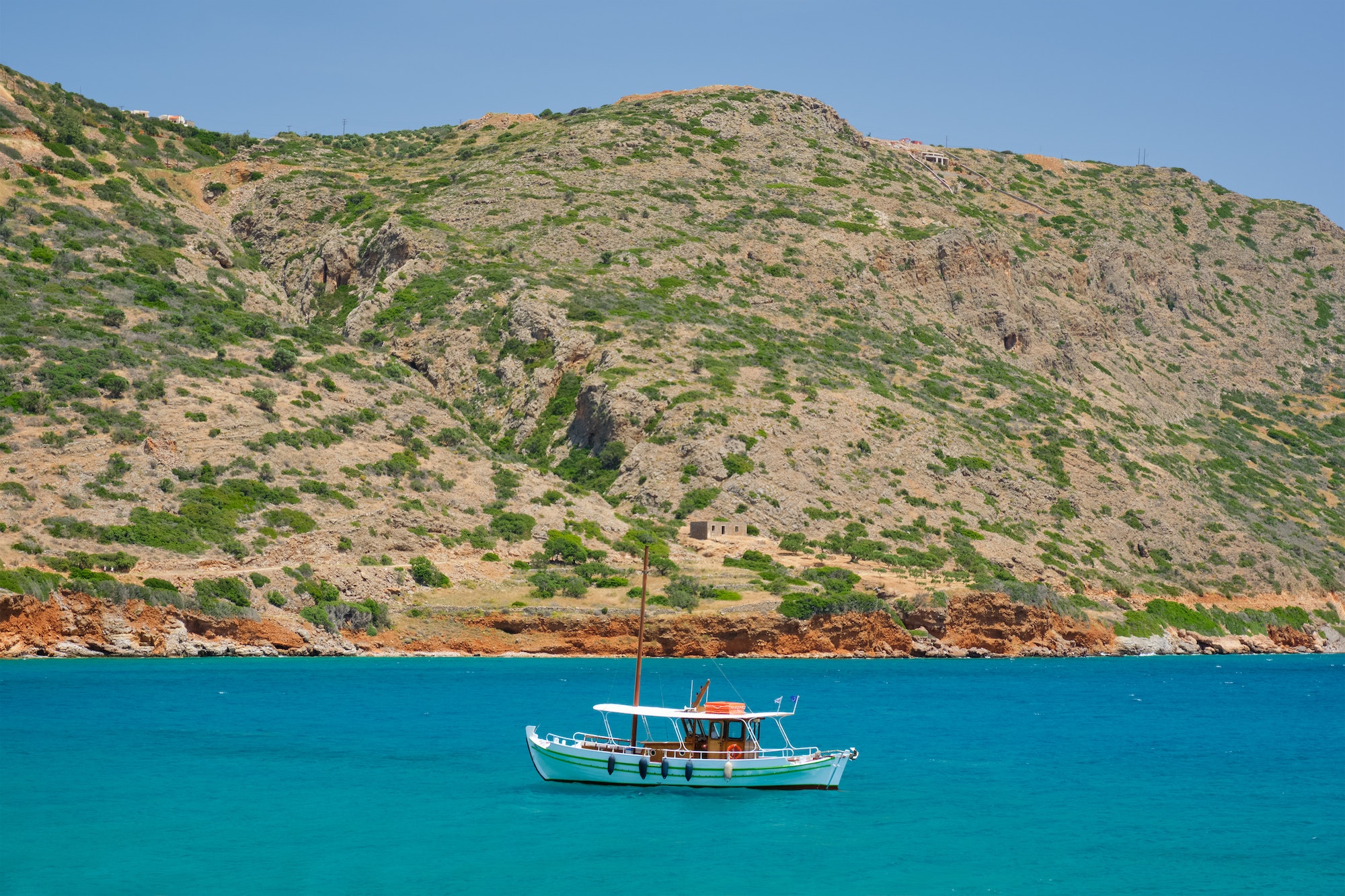 Greek traditional fishing boat in sea. Crete island, Greece