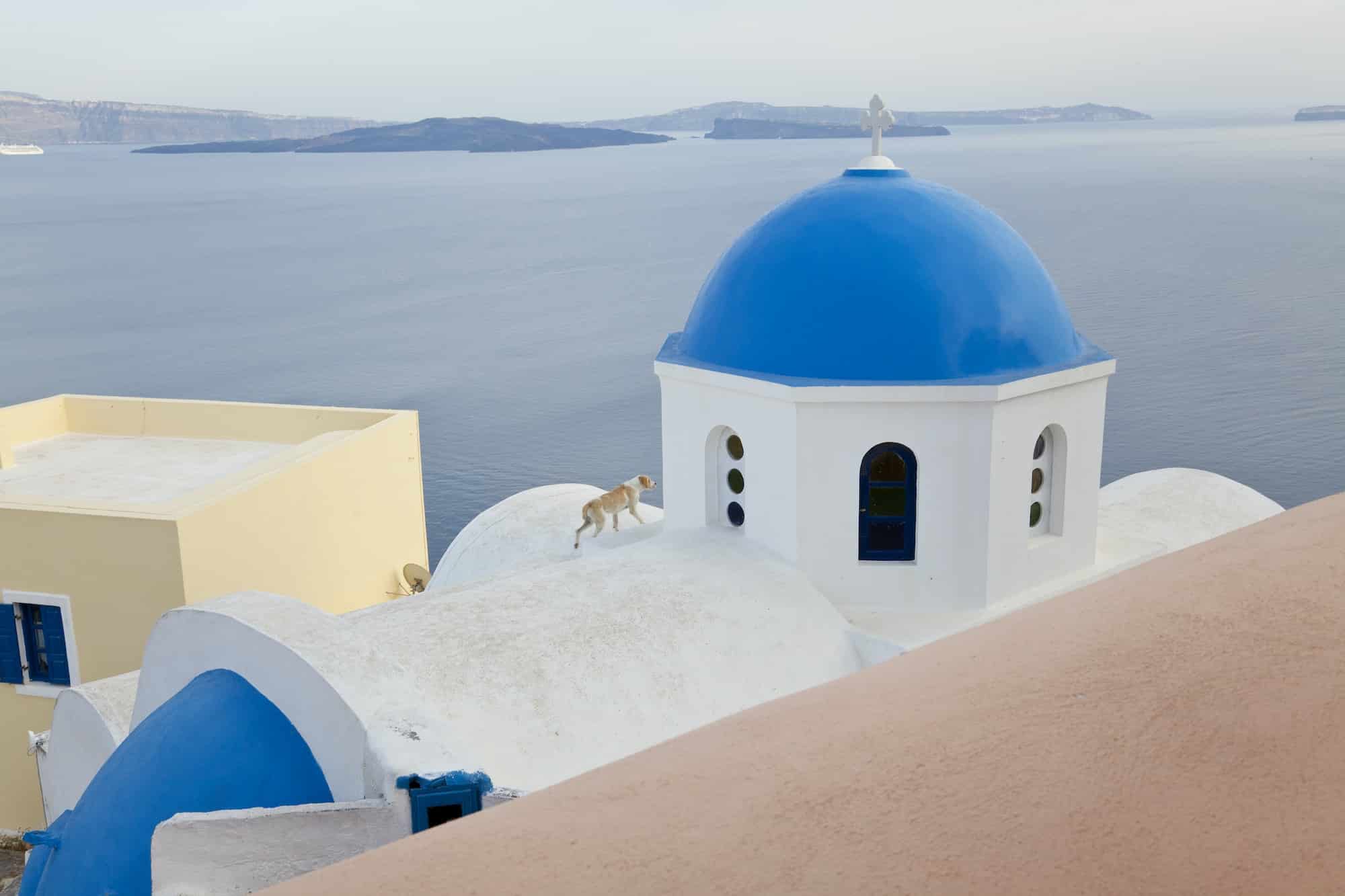 Church with bright blue dome on the island of Santorini