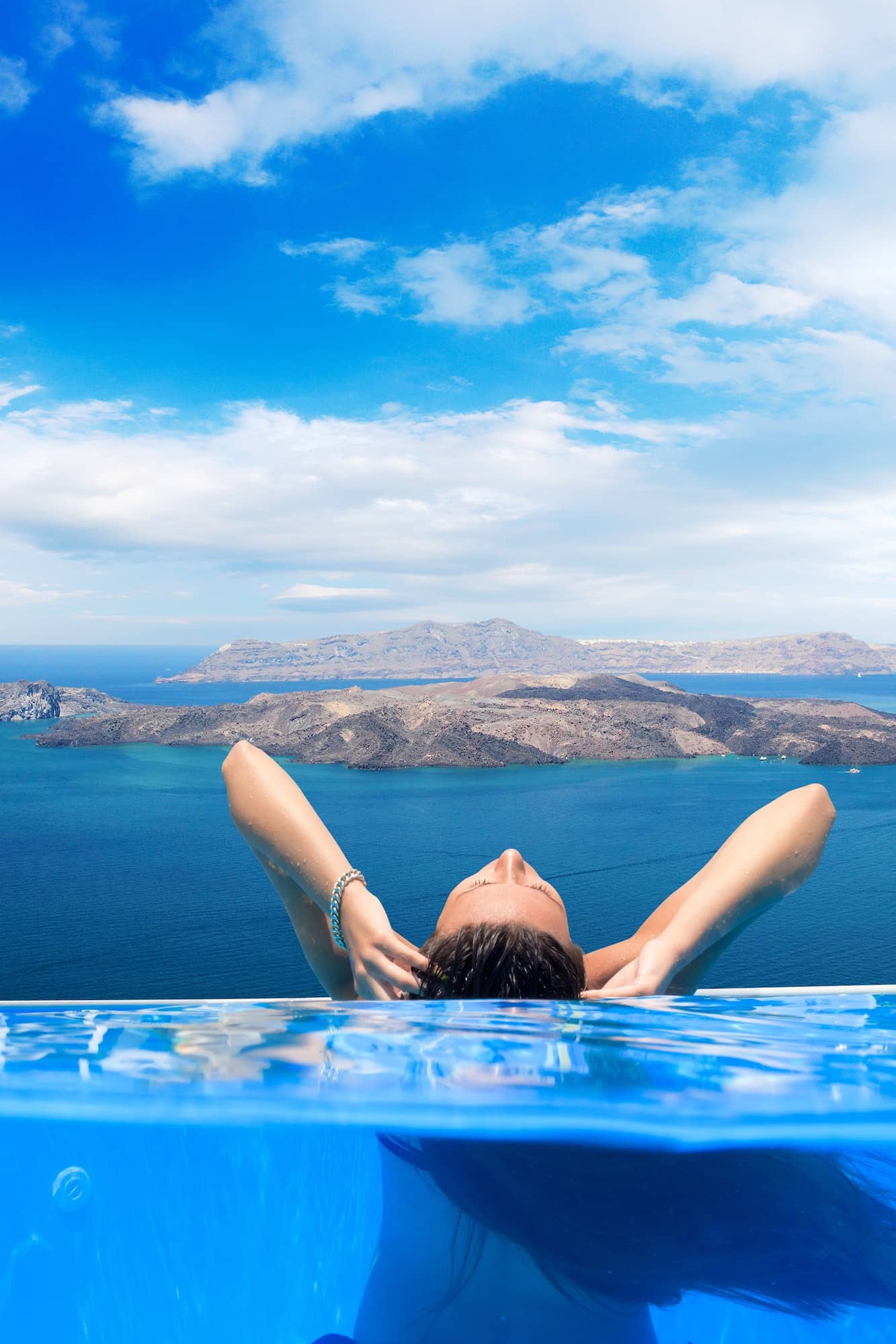woman enjoying the view of Santorini