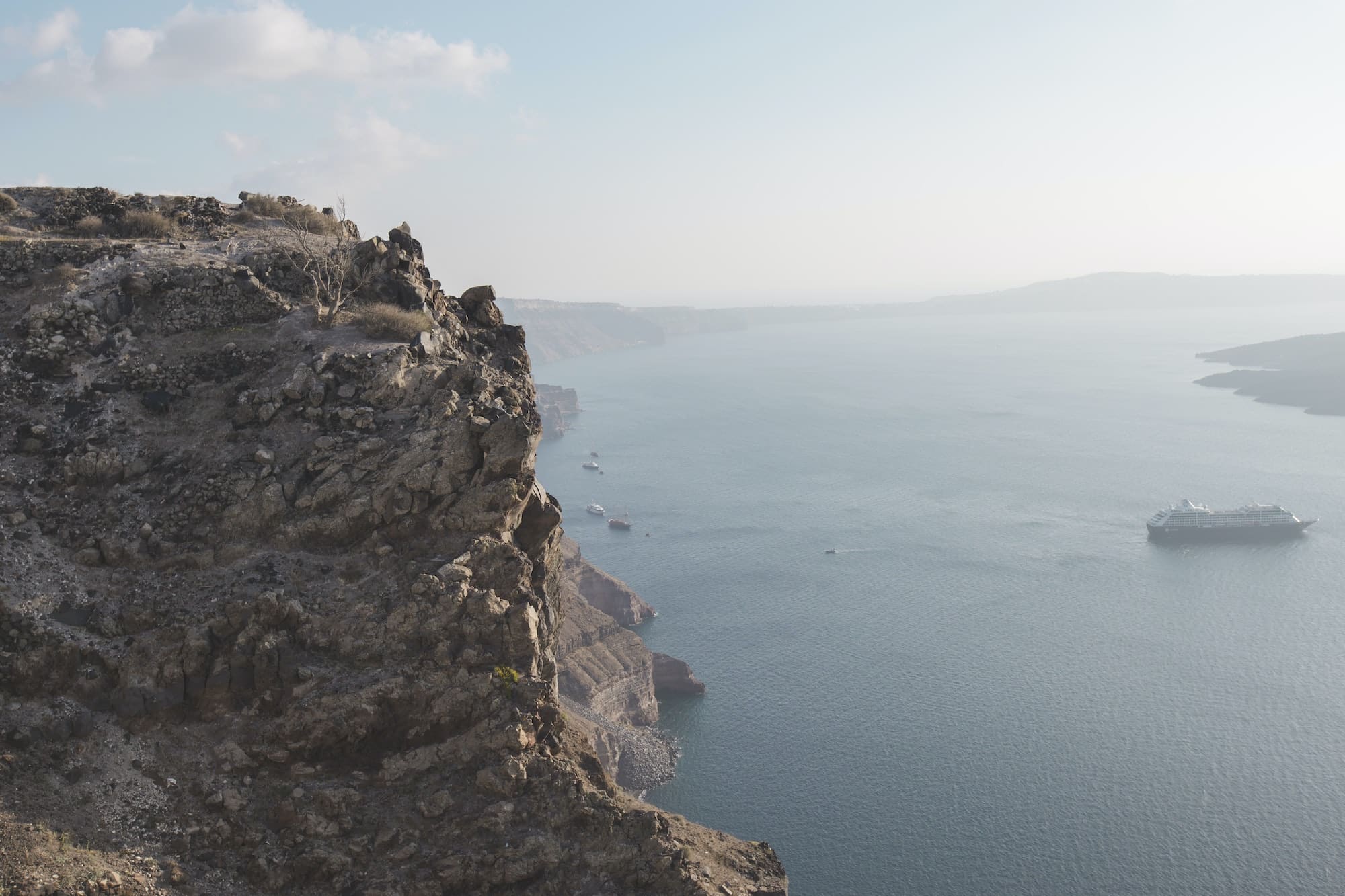 Cruise ship going through the Aegean Sea caldera through the Greek island of santorini
