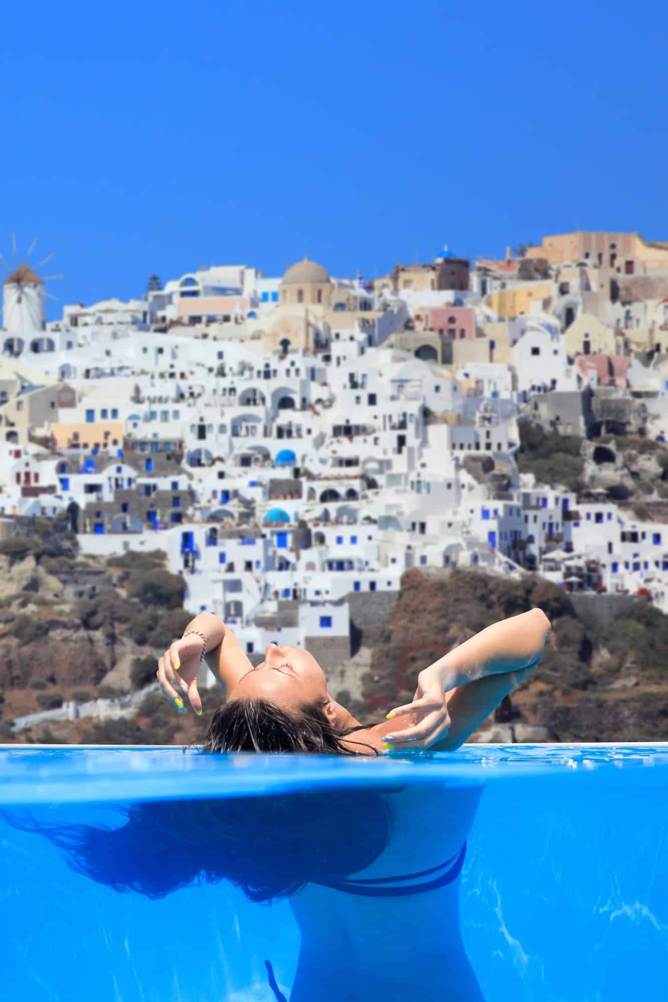 woman enjoying the view of Santorini